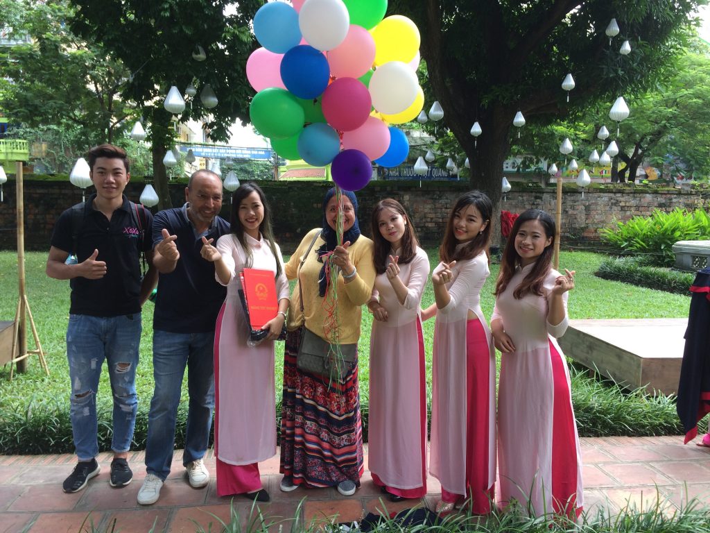 taking picture with students in hanoi